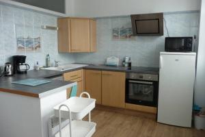 12 RDC Appartement 2 chambres jardin terrasse