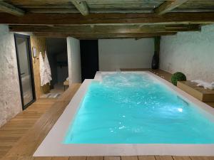 Appartement avec jardin et spa dans corps de ferme