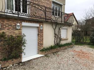 Appartement fond de jardin rez-de-chaussée