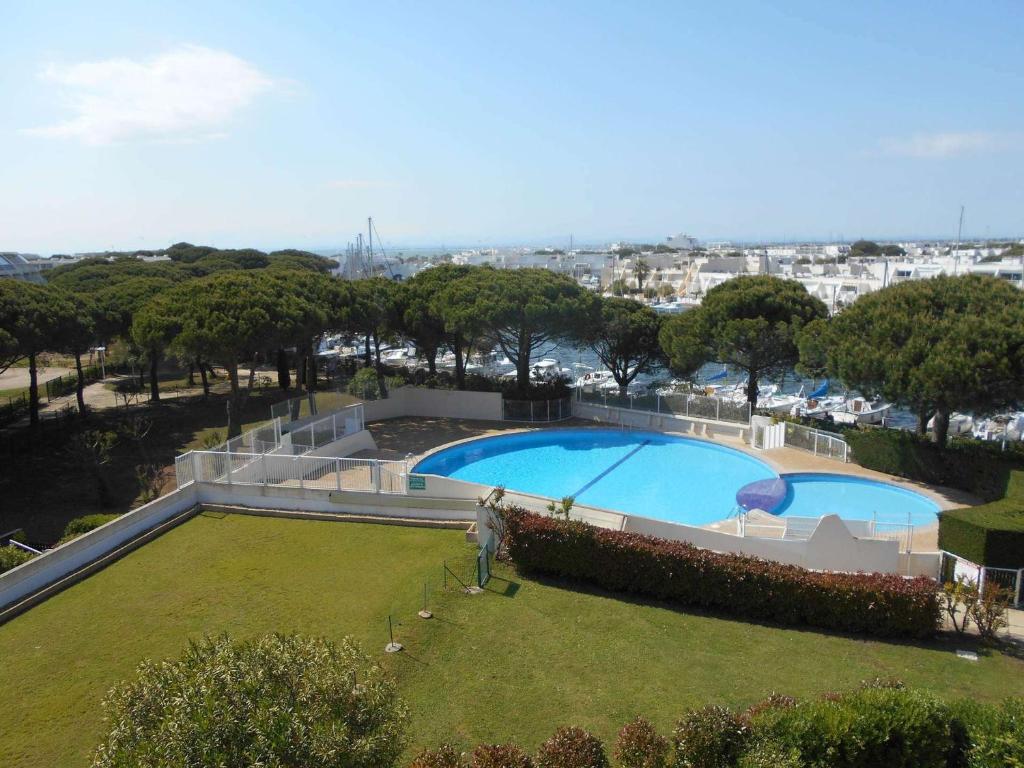 Appartement Appartement Port Camargue, 1 pièce, 4 personnes - FR-1-250-240 14 ROUTE DES MARINES ENTREE 14 - 3 EME ETAGE - APPARTEMENT 410 - PK COM 30240 Le Grau-du-Roi