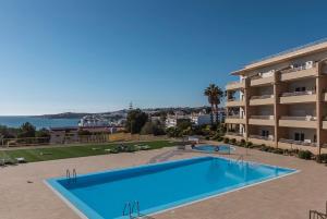 Beach flat, private garage, 2 swimming pools children adults, tennis court in secured complex