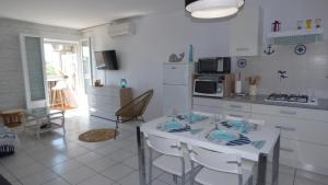 Coquet T2 climatisé, véranda vue mer, Le Caounil, St Pierre la Mer