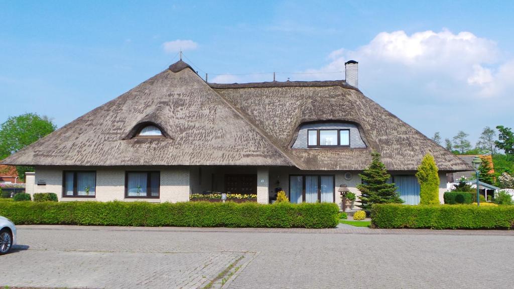 Ferien im Reetdachhaus Wacholderweg 8, 26532 Berumerfehn