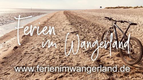 Ferien im Wangerland Ferienwohnung MUSCHEL Minsen Schillig Hund Pool Sauna