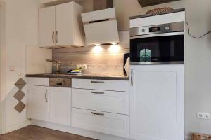 Ferienwohnung-5-mit-Terrasse-Friesenhus-Weisse-Moewe-Duhnen