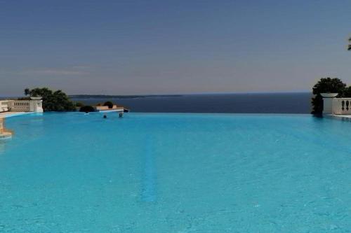 Furnished air-conditioned apartment with terrace swimming pool & parking