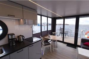 Hausboot Fjord Auriga mit Biosauna in Wendtorf