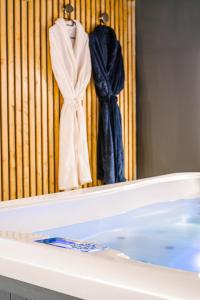 L'alcôve du 510 - Spa - chambre romantique - sauna - salle de jeux
