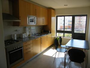 Luxurious first floor apartment with balconies overlooking pool and gardens.