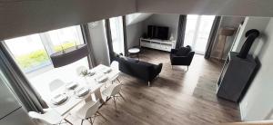 moderne Neubau-Wohnung mit Kamin und 35qm Dachterrasse