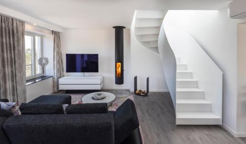 Penthouse am Südstrand - Kamin, Dachterrasse mit Meerblick und Gasgrill, Luxus-Design-Apartment, 2 Minuten zum Strand