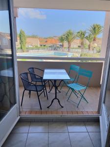 Studio cabine pour 4 personnes avec piscine commune