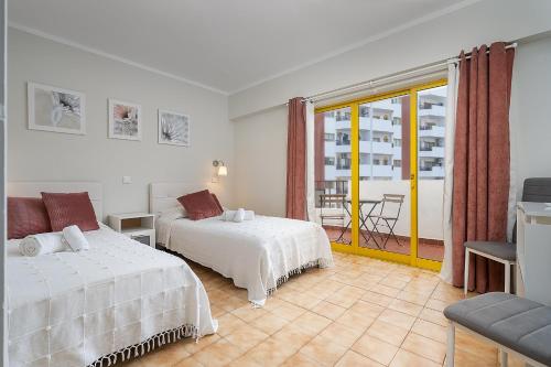 Sunny Flat W/ Balcony & Pool by LovelyStay