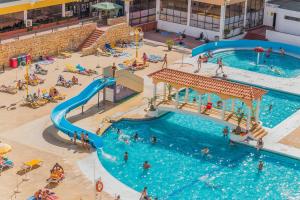 Sunny Flat W/ Balcony & Pool by LovelyStay