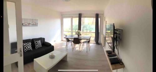 Superbe appartement spacieux avec parking et jardin privé