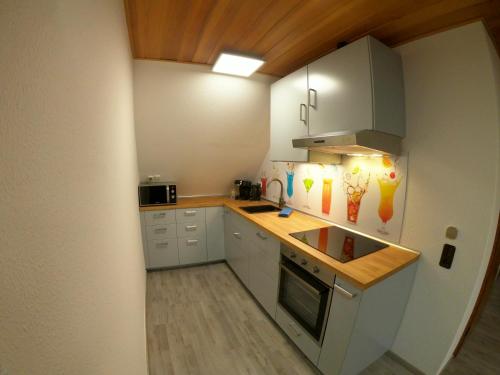 Harste Ferienhaus Ozga mit Balkon und Garten