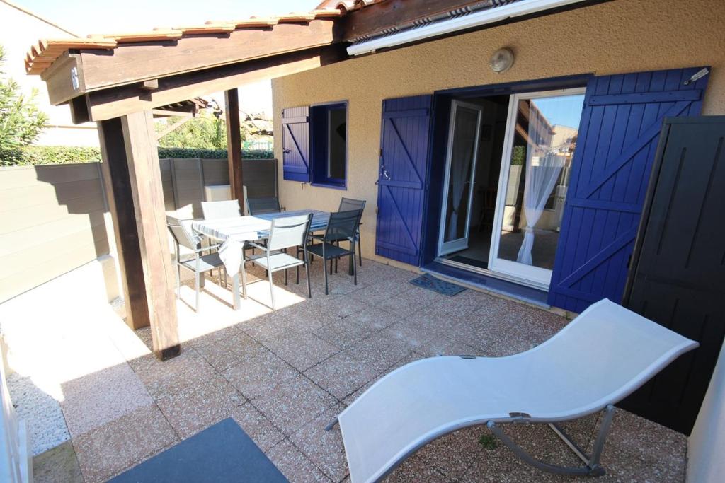 Villa Belle villa d angle rénovée, 5 couchages, 100 m de la plage, 1 chambre, 1 grande mezzanine climatisée, terrasse ombragée parking dans résidence sécurisée LRVM66 AVENUE DU BOSQUET, 34420 Portiragnes