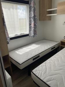 Assist' Mobil Home 389 - Mobil home récent 3 chambres 8 couchages