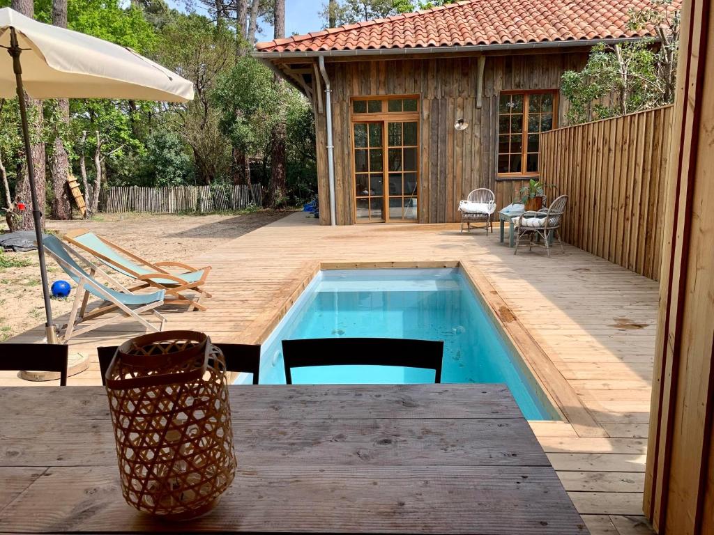 Villa Cap Ferret villa bois avec piscine dans le village de Piquey ref 5 route du truc vert, 114, 33950 Lège-Cap-Ferret