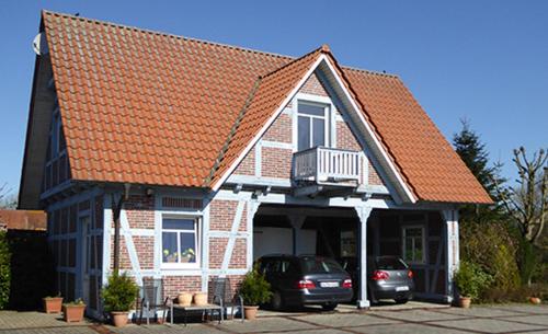 Casa Carina Ferienhaus, Oberwohnung mit kleinem Sonnenbalkon und Terrasse Süderschweiburg allemagne