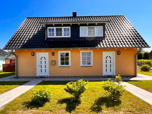 Maison de vacances Ferienhaus Anna - linke Seite Zur Kreptitzer Heide 13 a Dranske