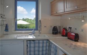 Amazing home in Boure with 3 Bedrooms, Outdoor swimming pool and WiFi