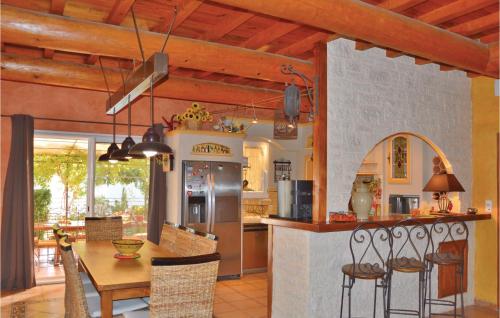 Amazing home in Fourques with 4 Bedrooms, WiFi and Outdoor swimming pool