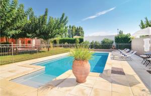 Amazing home in Fourques with 4 Bedrooms, WiFi and Outdoor swimming pool