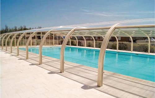 Amazing home in Grandcamp Maisy with 3 Bedrooms, WiFi and Outdoor swimming pool