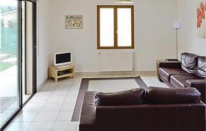 Awesome home in Pomas with 3 Bedrooms and Outdoor swimming pool