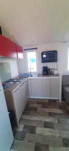 Bungalow de 2 chambres avec piscine partagee jardin amenage et wifi a Grandcamp Maisy