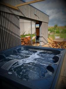 Cottage chaleureux avec Sauna & Jacuzzi