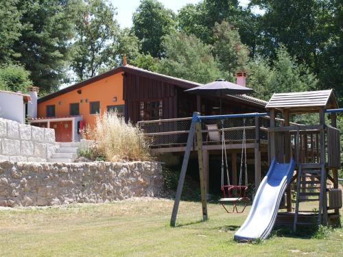 Detached house with a large porch, playground and pool