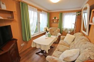 Ferienhaus mit Ruderboot Kummerow SCHW 982