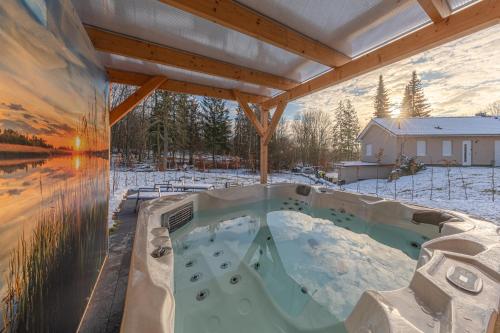Ferienhaus mit Whirlpool und SUP am Plauer See