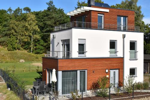 Ferienhaus-See-Sauna-Kamin-Hund mit E-Ladestation