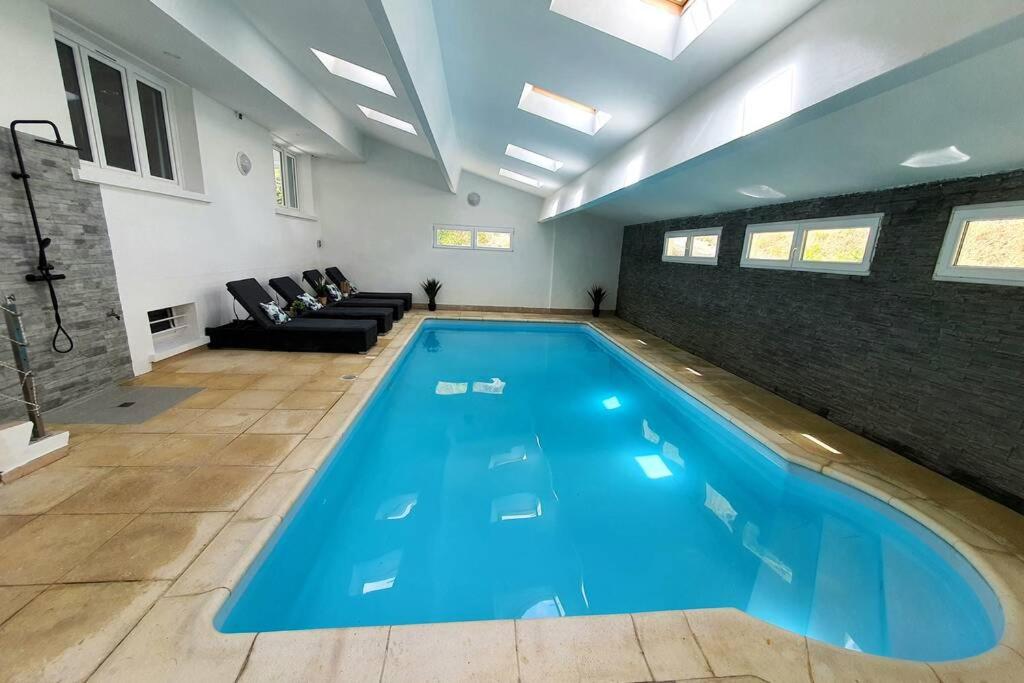 House in a green setting with swimming pool