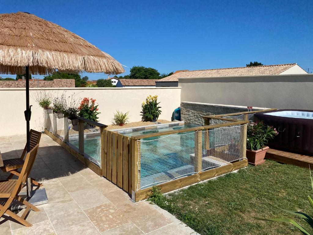 Maison de vacances Jolie maison cocoon piscine/jacuzzi 4 rue des iris 17620 saint Agnant 17620 Saint-Agnant