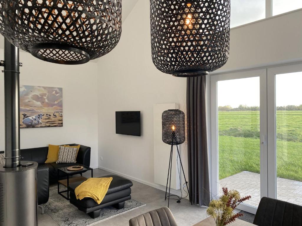 Kuh Blick Ferienhaus Sehestedt Brachvogelweg 40, 26349 Sehestedt