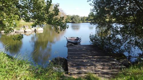 Maison Rouge Adossee a la Colline et son Etang