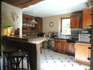 Maison Rouge Adossee a la Colline et son Etang