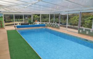 Nice home in Juigne Sur Sarthe with 4 Bedrooms, WiFi and Private swimming pool