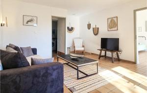 Nice home in Le Grand-Village-Plage with WiFi and 4 Bedrooms