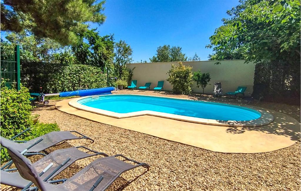 Nice home in Lespignan with Outdoor swimming pool, 5 Bedrooms and WiFi , 34710 Lespignan