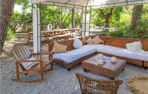 Nice home in Lespignan with Outdoor swimming pool, 5 Bedrooms and WiFi