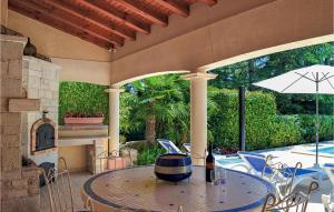 Nice home in Savignac les Eglises with 3 Bedrooms, WiFi and Outdoor swimming pool