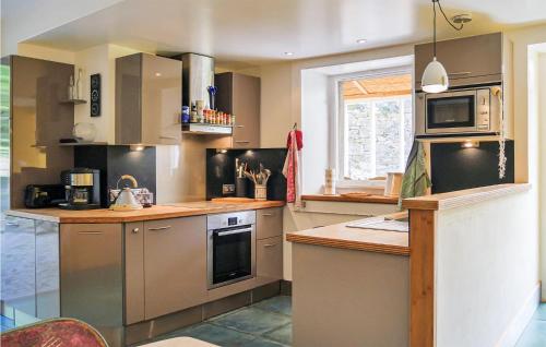 Nice home in ST GERMAIN DES VAUX with 3 Bedrooms and WiFi