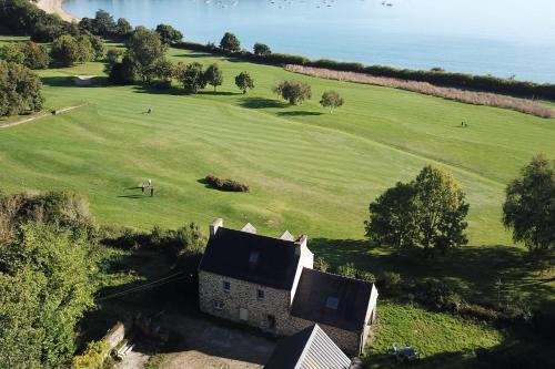 Stone house with view on the sea and the golf