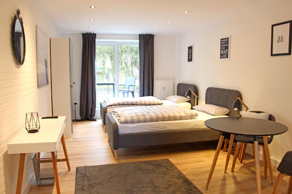 Appartement Moderne 1-Zimmer Wohnung mit Terasse, Küche, Bad mit Dusche, TV & WIFI 6A Tannenbergweg, 30938 Burgwedel