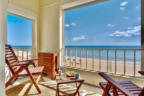 Premium Beachfront Apartment w South Facing Terrace Quarteira portugal